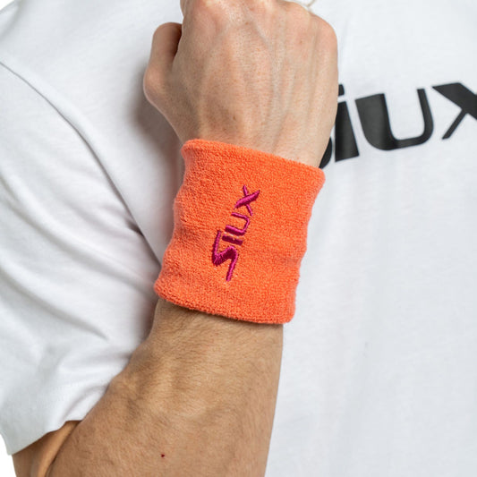 PACK 2 MUÑEQUERAS SIUX REVEAL NARANJA/FUCSIA SS25