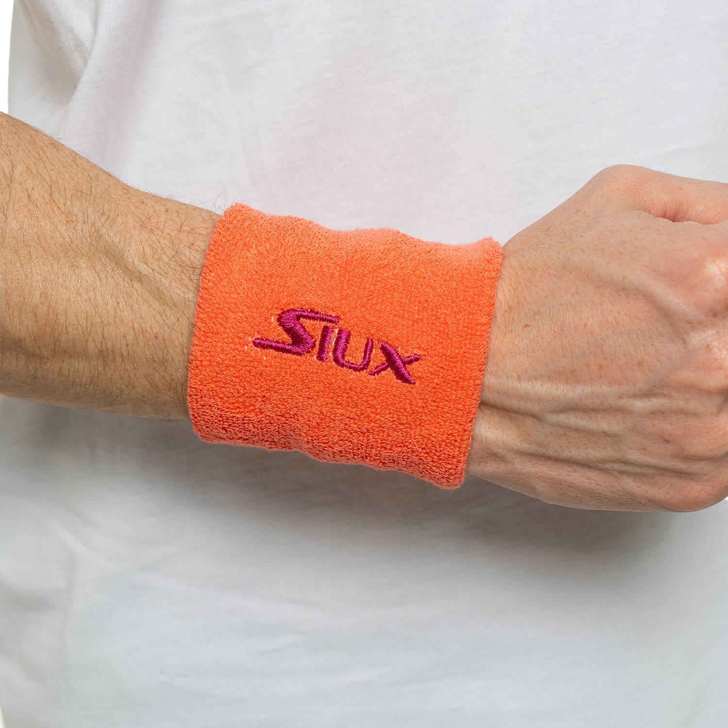 PACK 2 MUÑEQUERAS SIUX REVEAL NARANJA/FUCSIA SS25